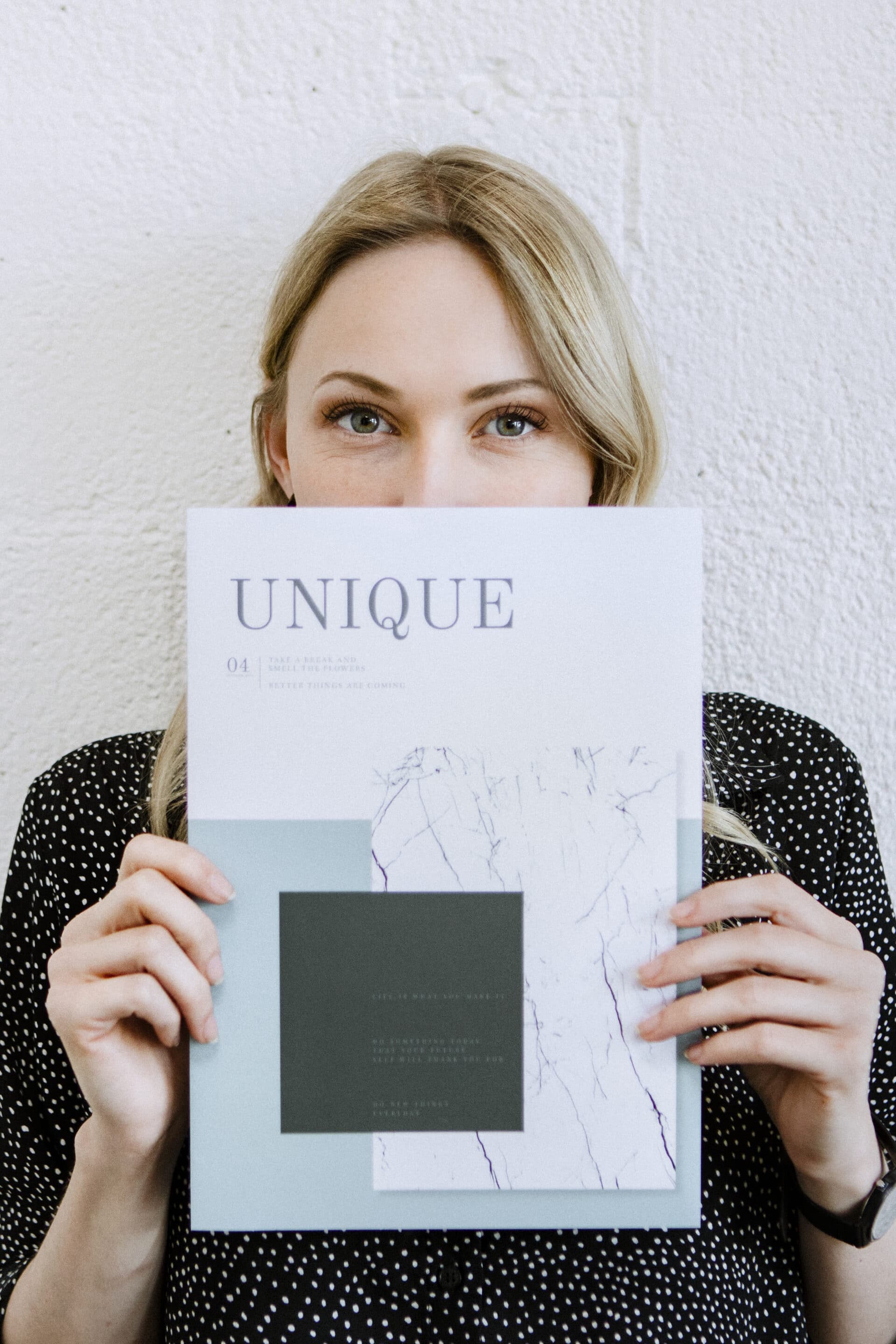 woman holding a magazine 2022 12 16 00 16 33 utc scaled